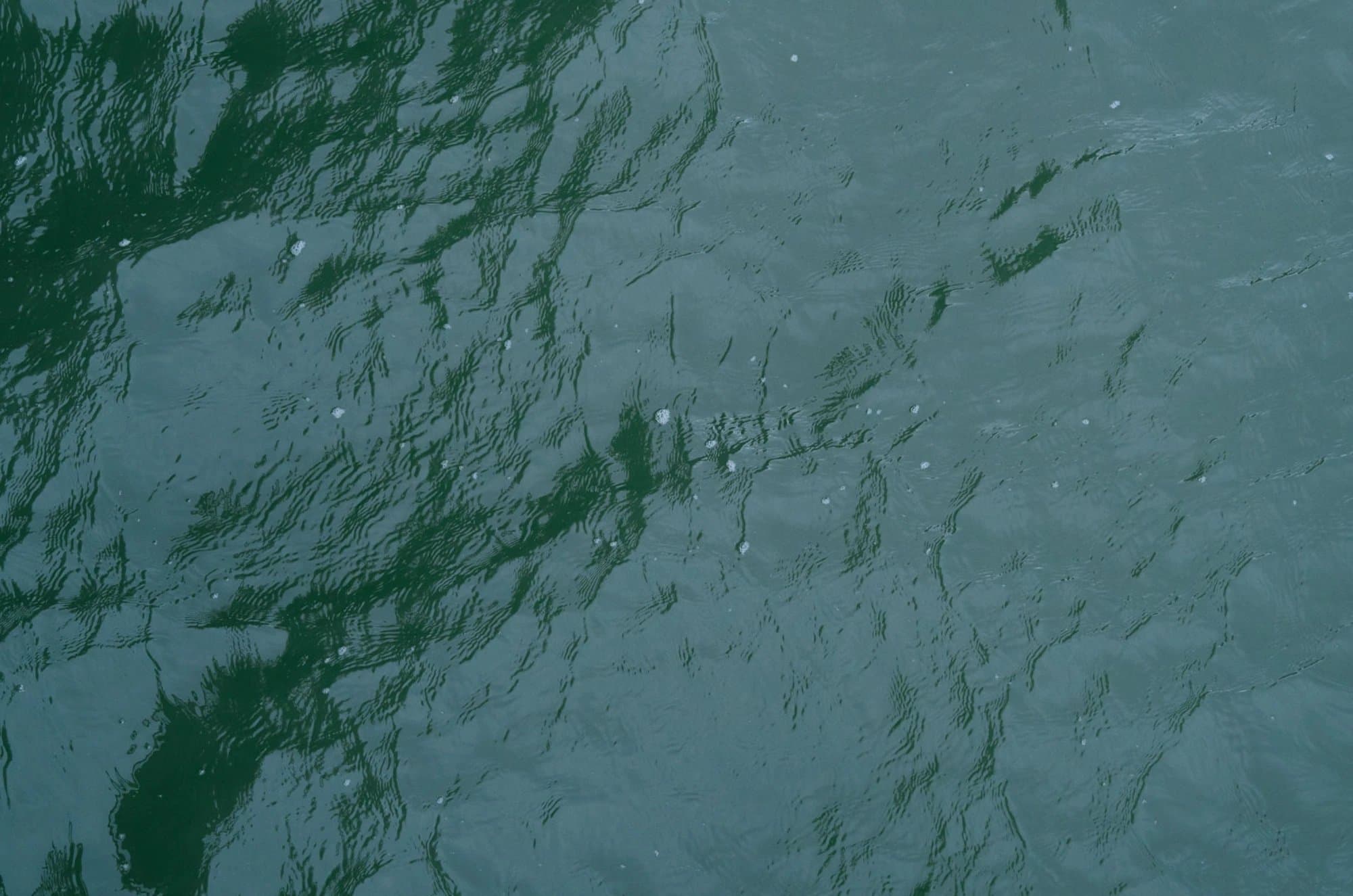 Rippling green-blue water seen from above