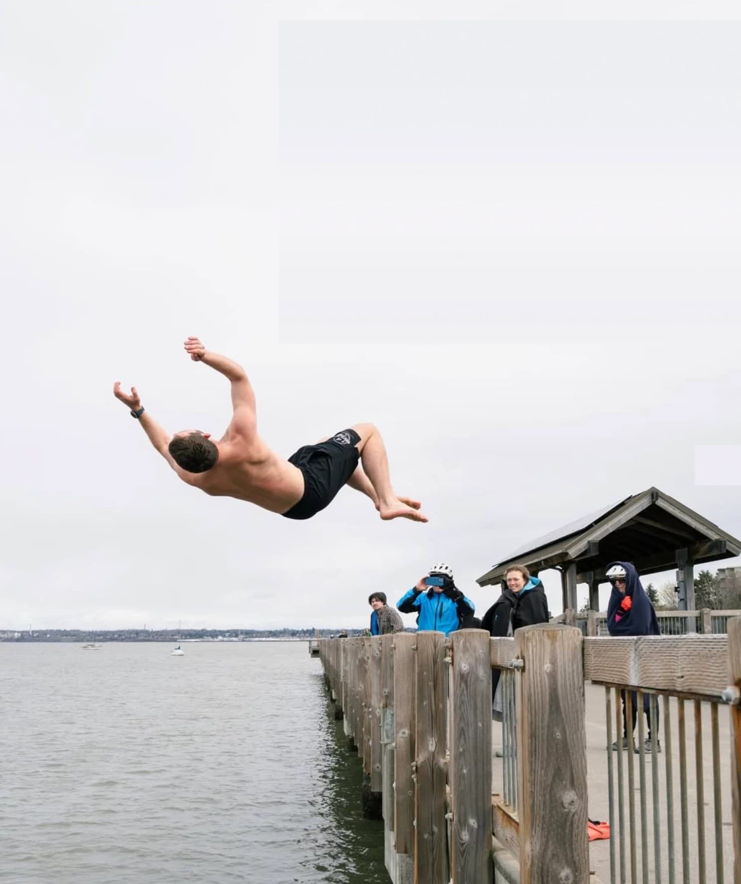 Ethan Hunger mid-backflip off the dock